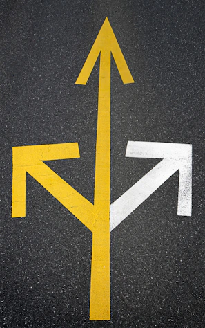 A yellow and white arrow pointing to the right