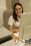 A woman sitting at a desk in front of a computer
