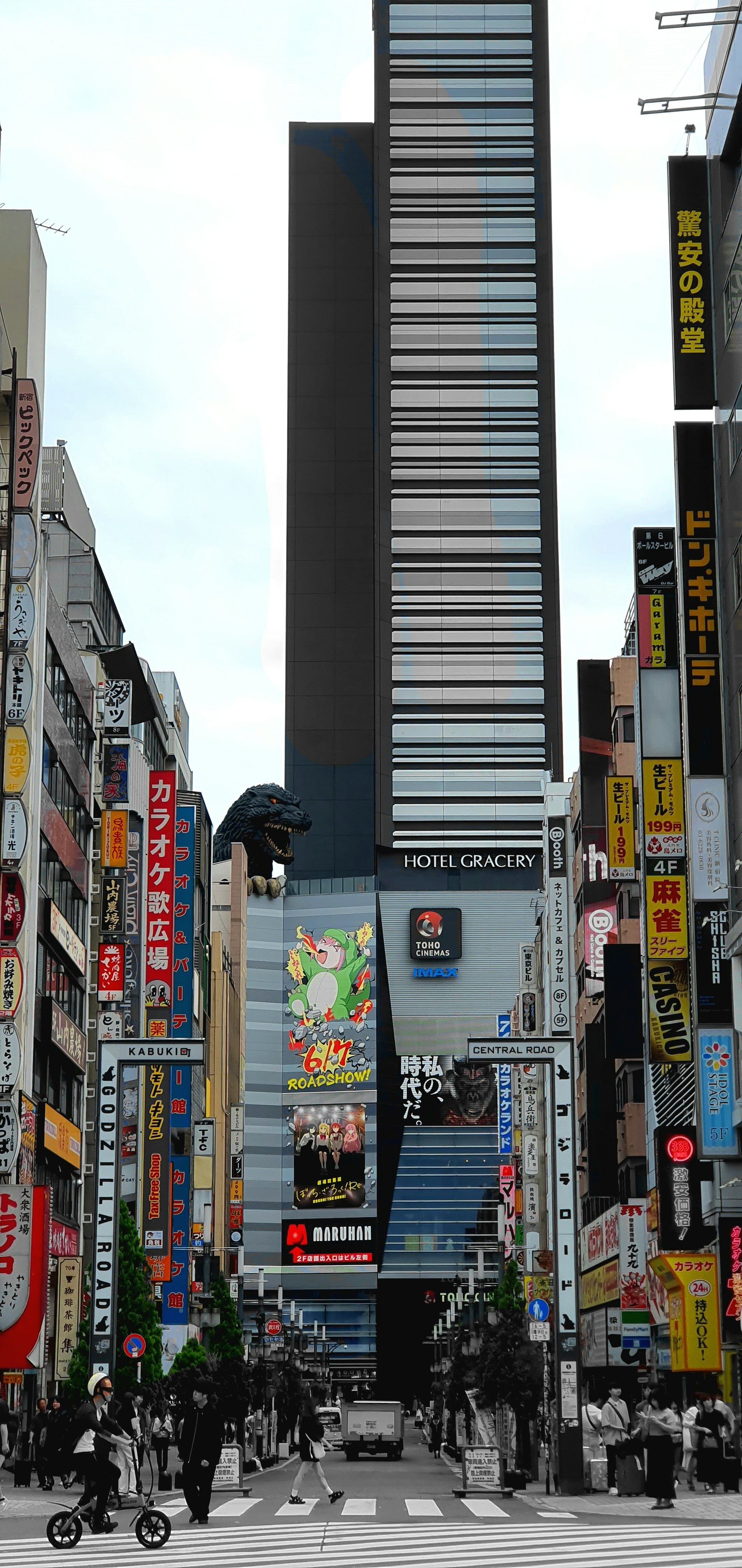 A city street filled with lots of tall buildings