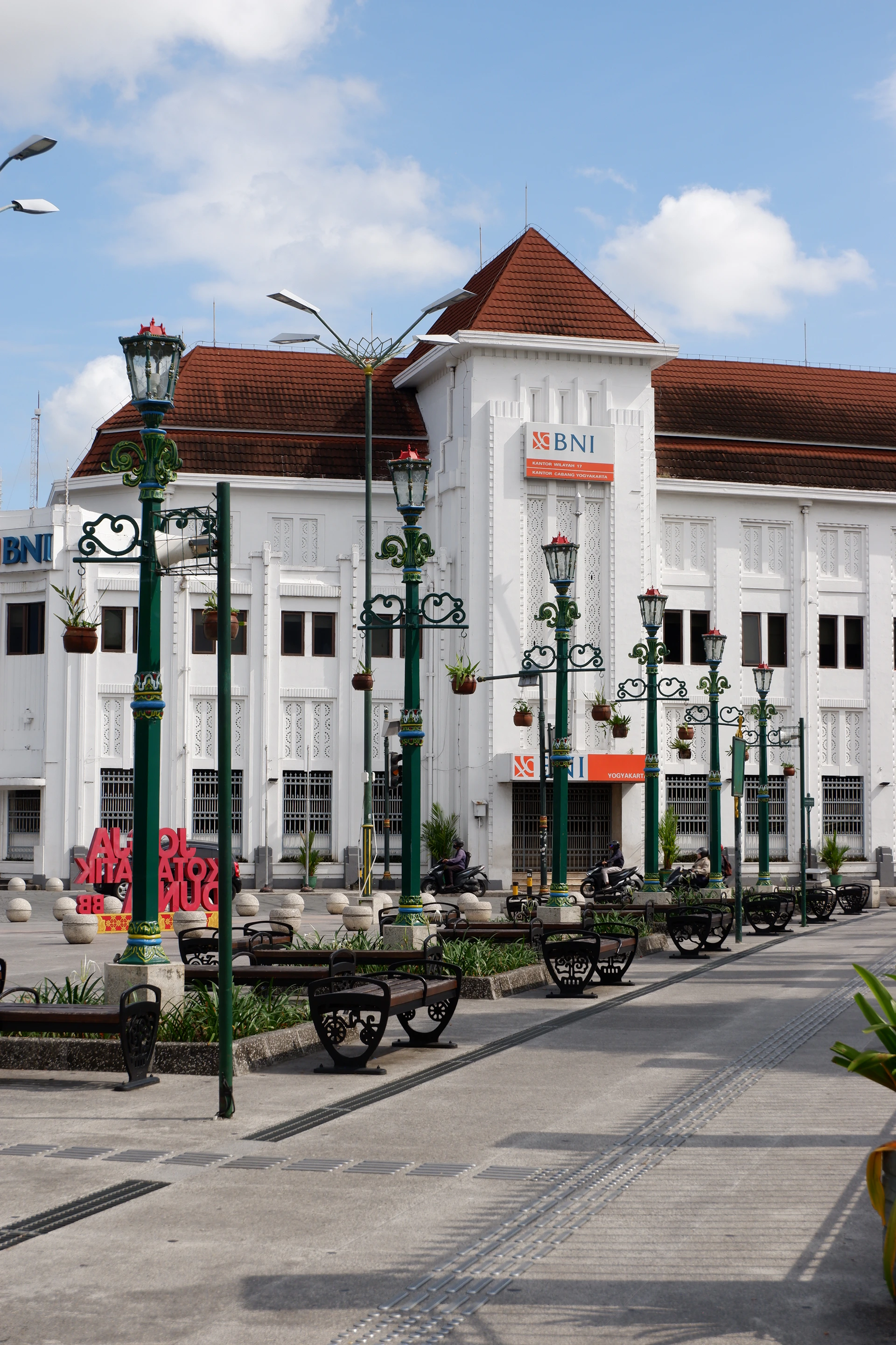 A large white building sitting next to a street