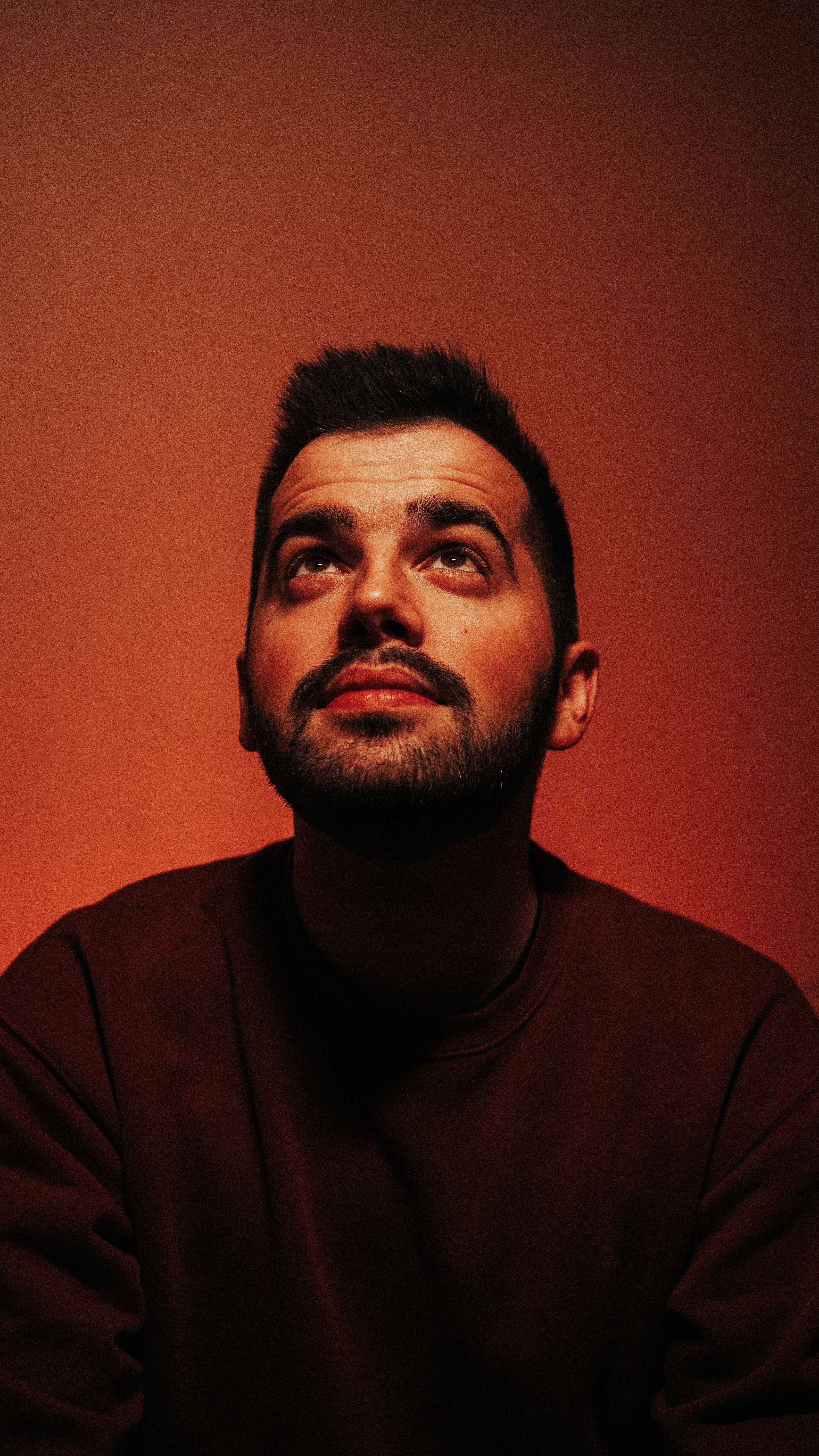 A man with a beard and a black shirt