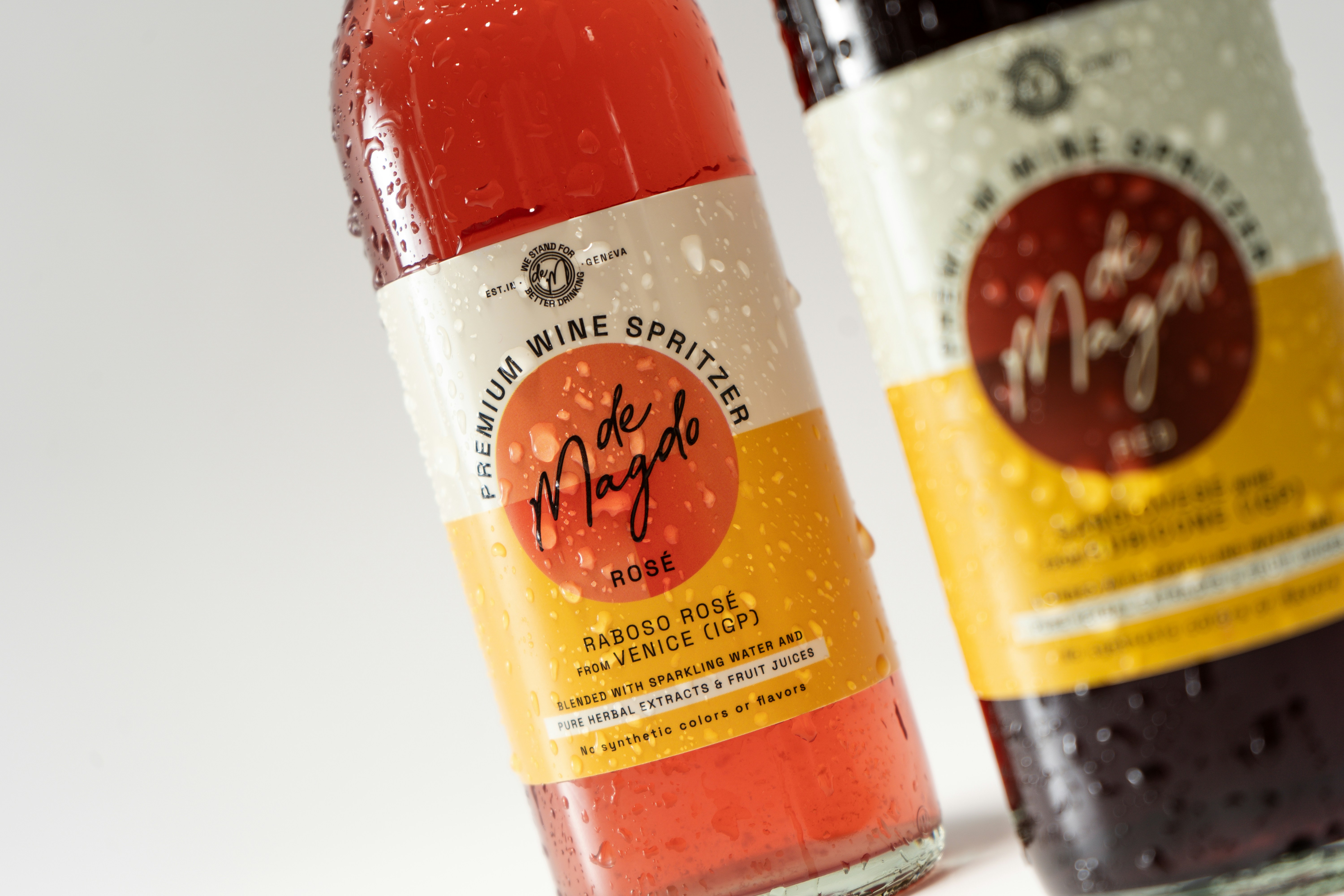 Two bottles of soda sitting next to each other