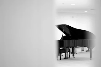 A black and white photo of a piano