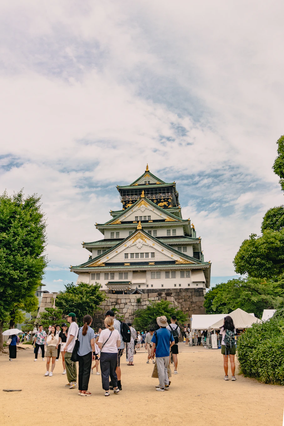 A group of people standing in front of a tall building