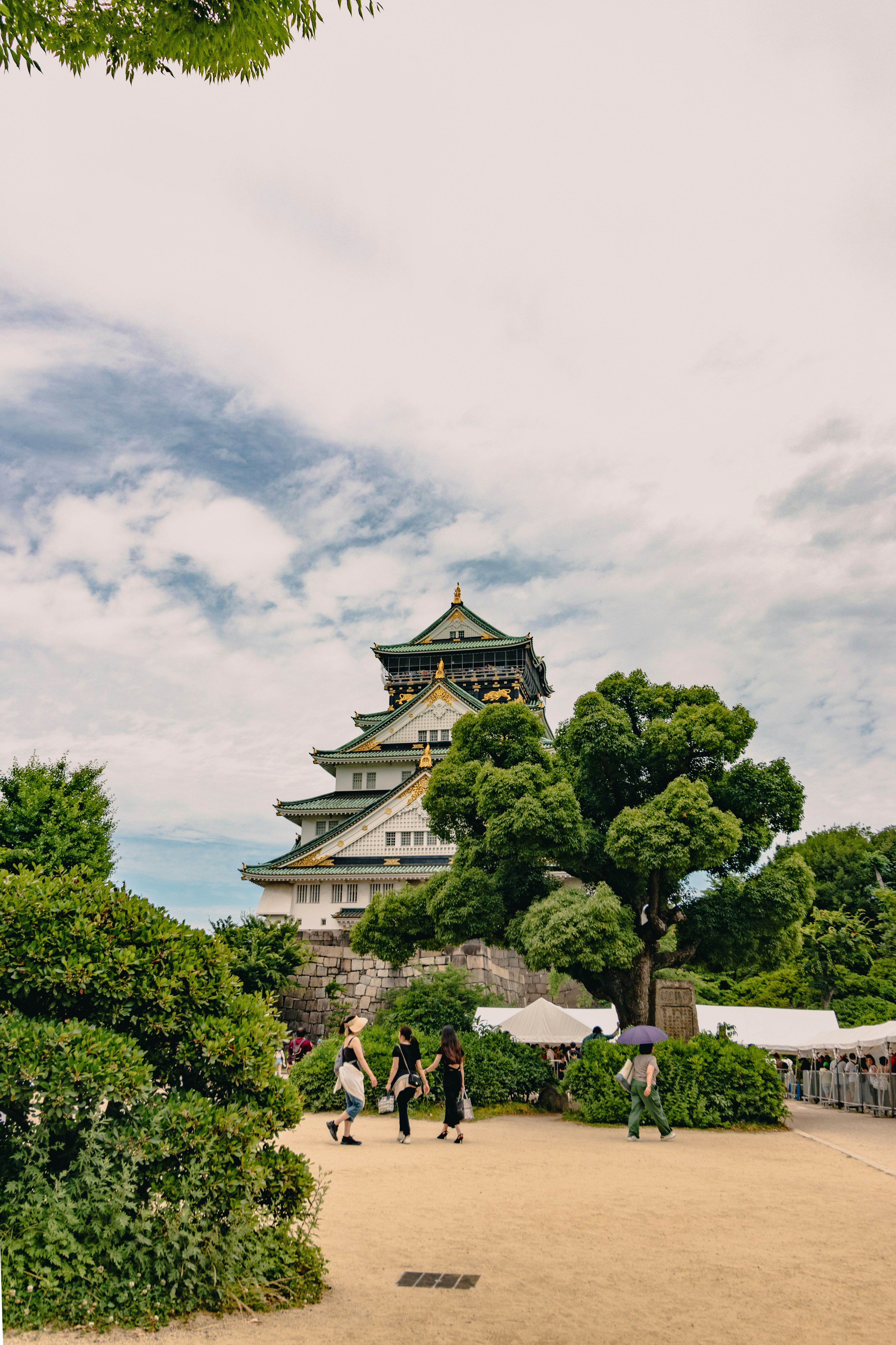 A group of people standing in front of a tall building