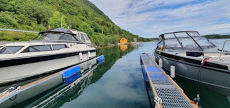 A couple of boats that are sitting in the water