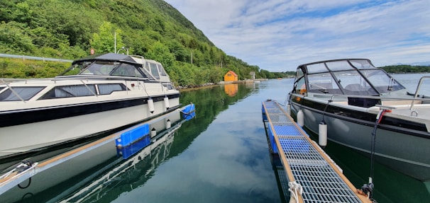 A couple of boats that are sitting in the water