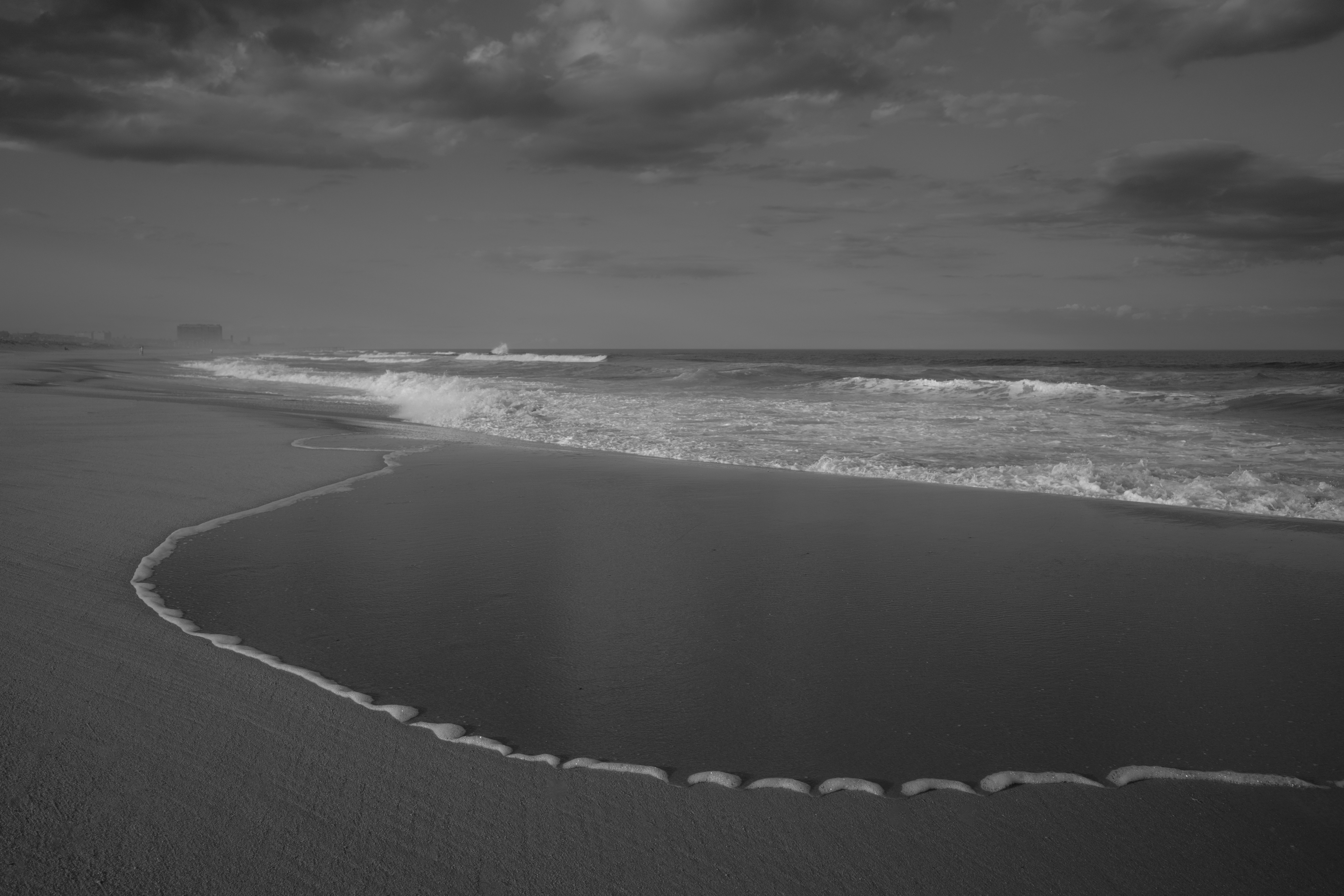 A black and white photo of a beach