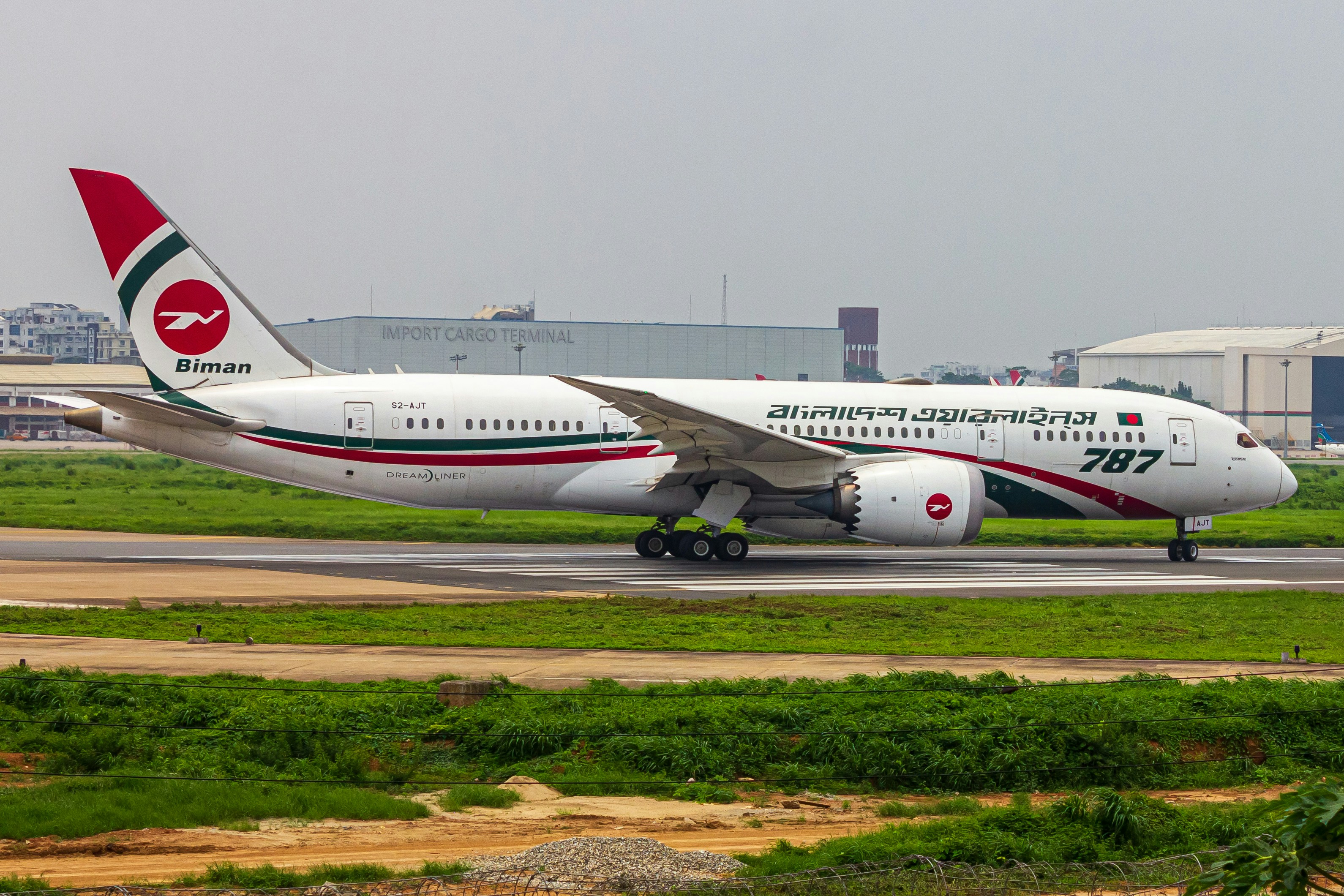 A large jetliner sitting on top of an airport runway, BIMAN BOEING 787-8 DREAMLINER 💥