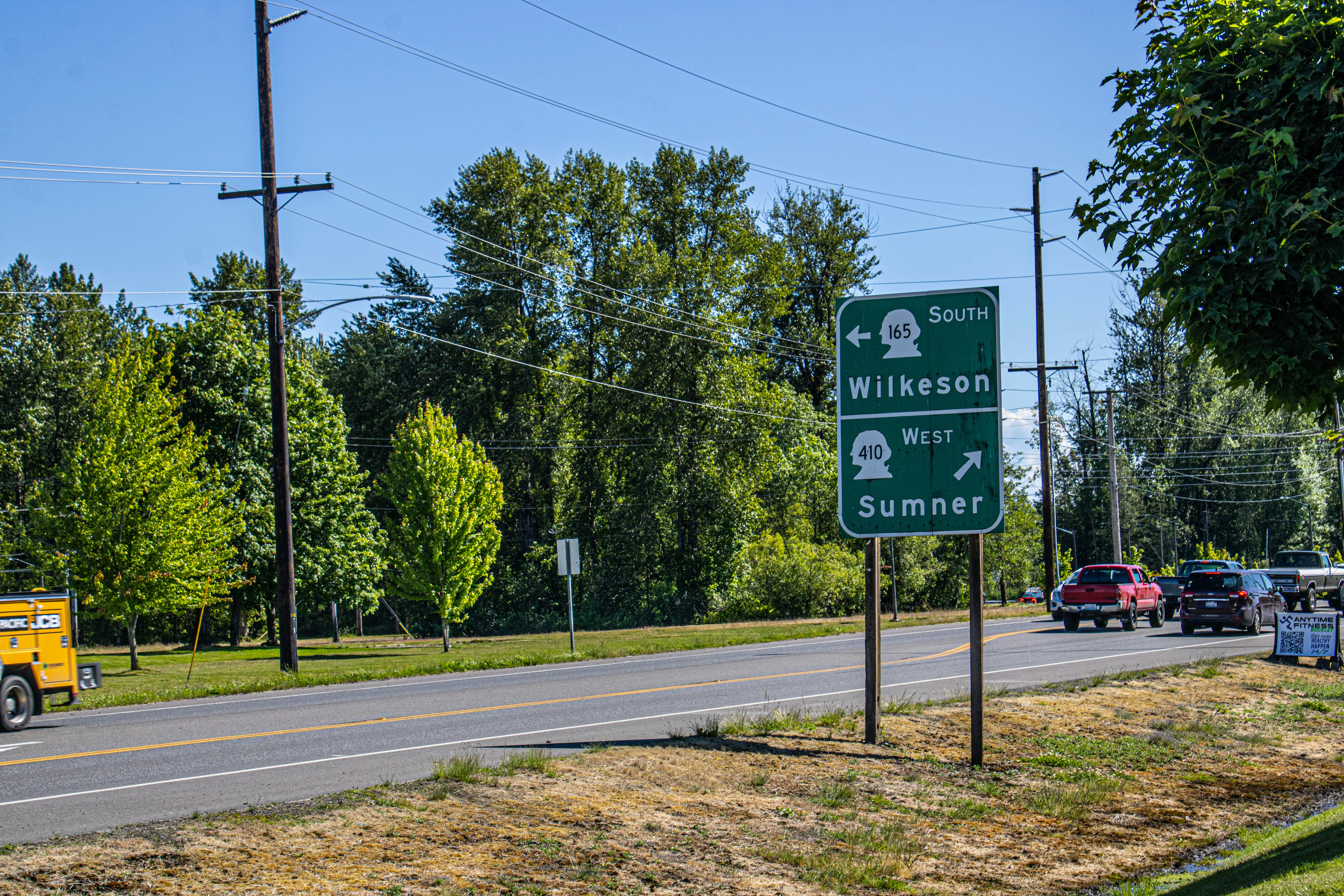 A street sign on the side of a road