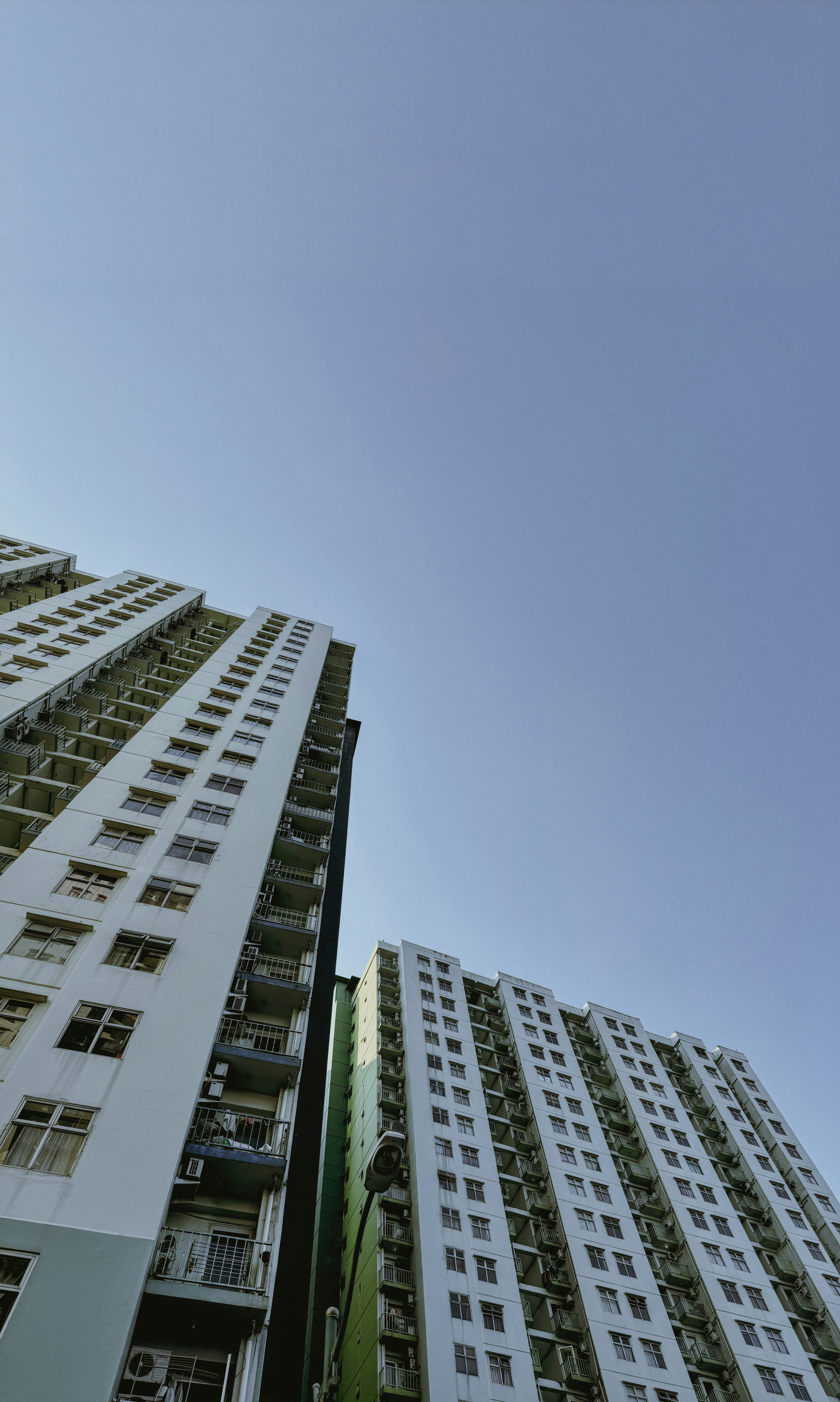 Looking up at tall buildings in a city