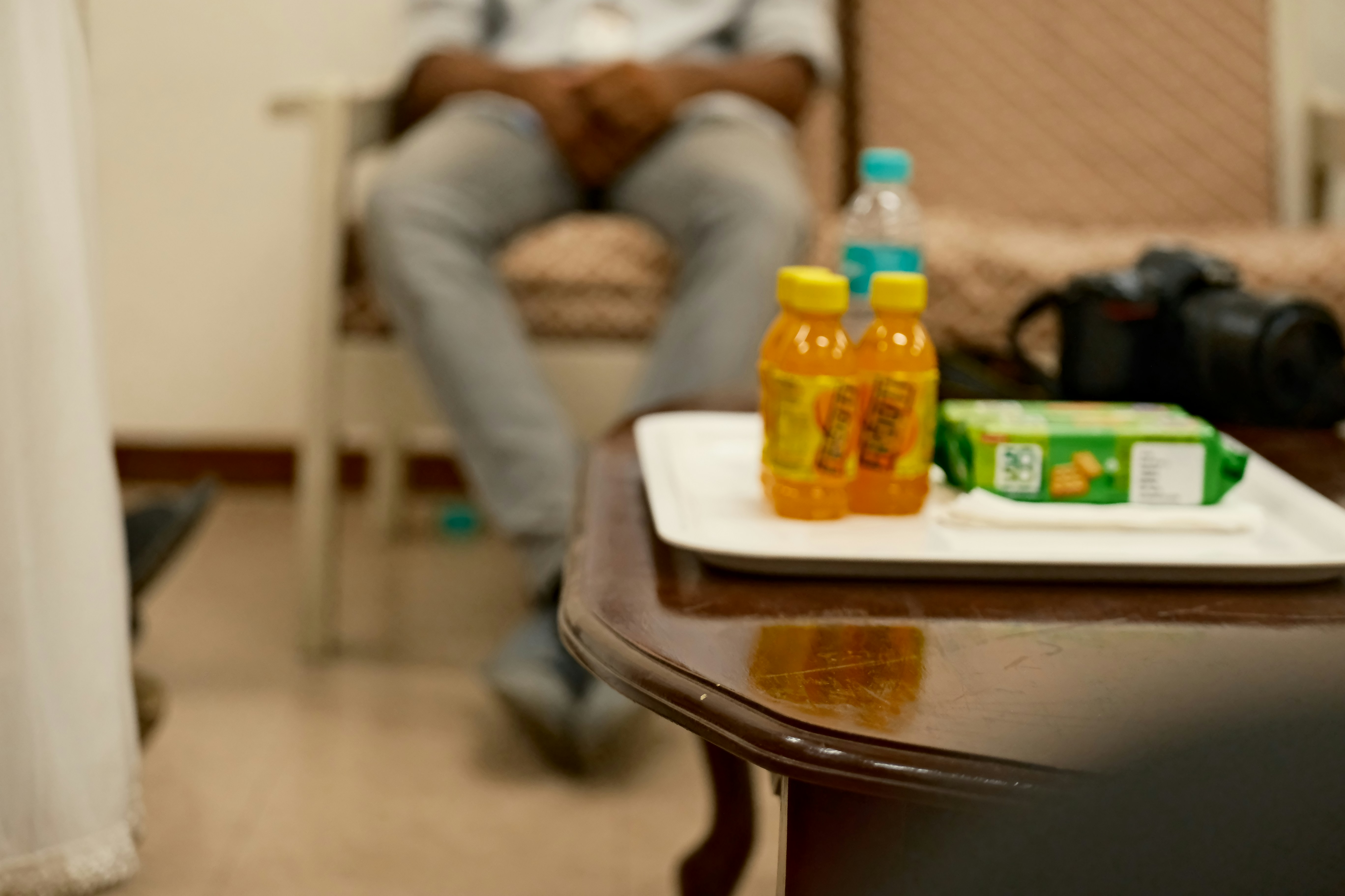 A man sitting in a chair in a living room