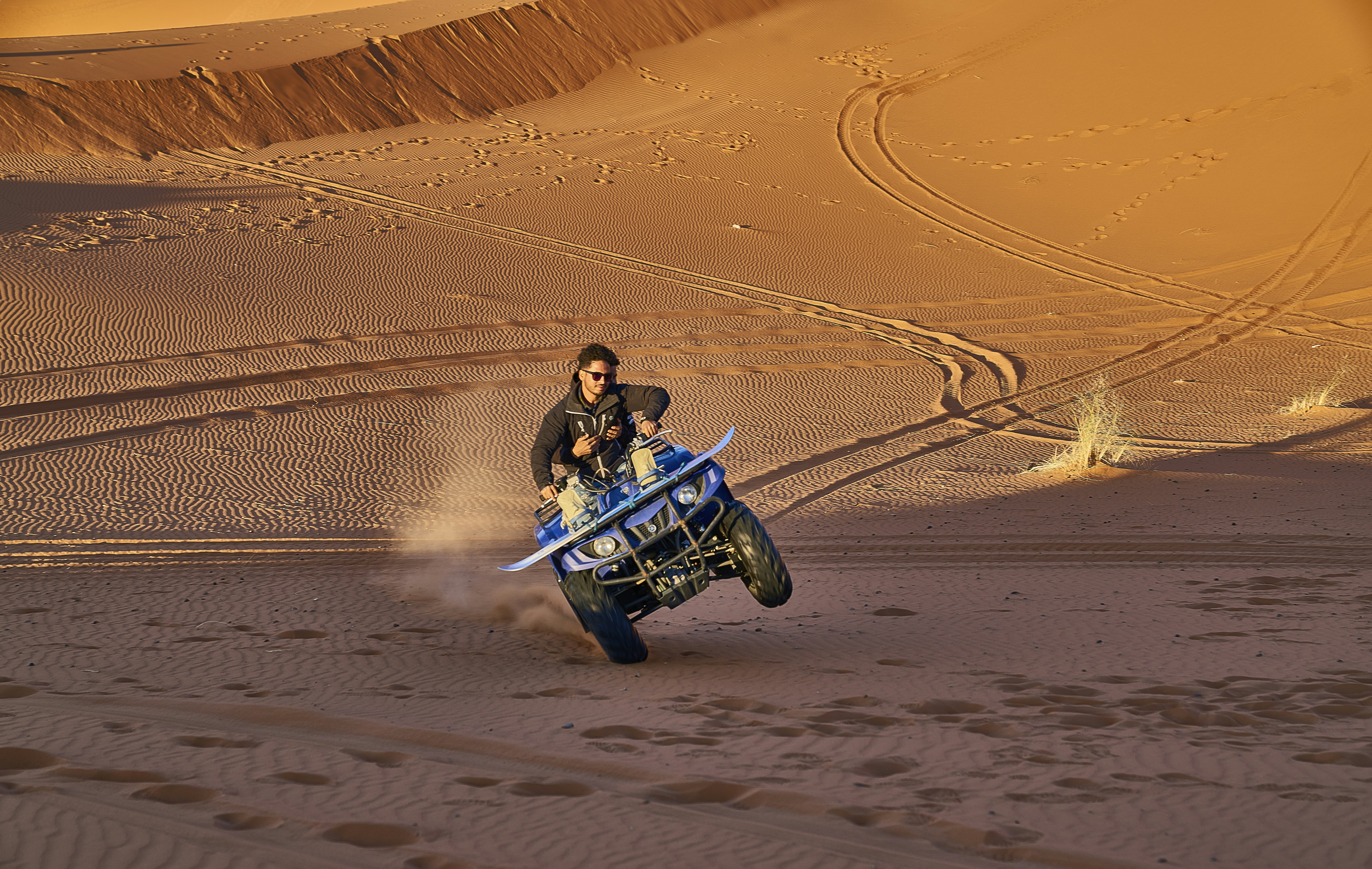 A man riding on the back of a dirt bike