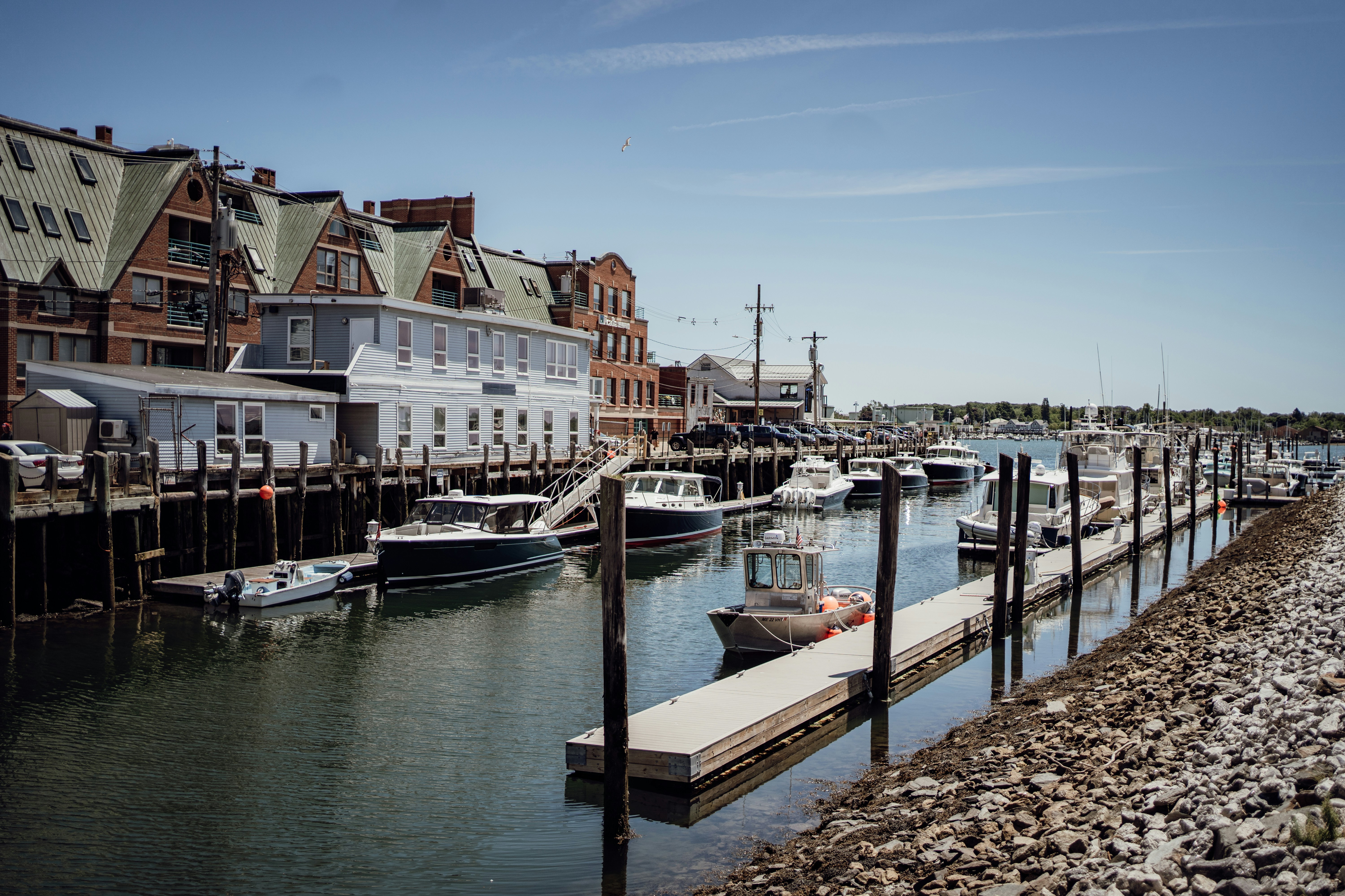 A harbor filled with lots of boats next to tall buildings