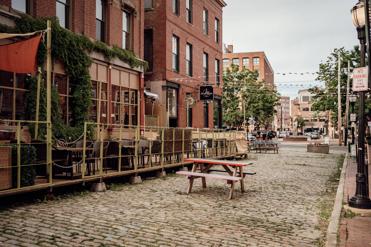 A brick street with outdoor tables in Portland's Old Port