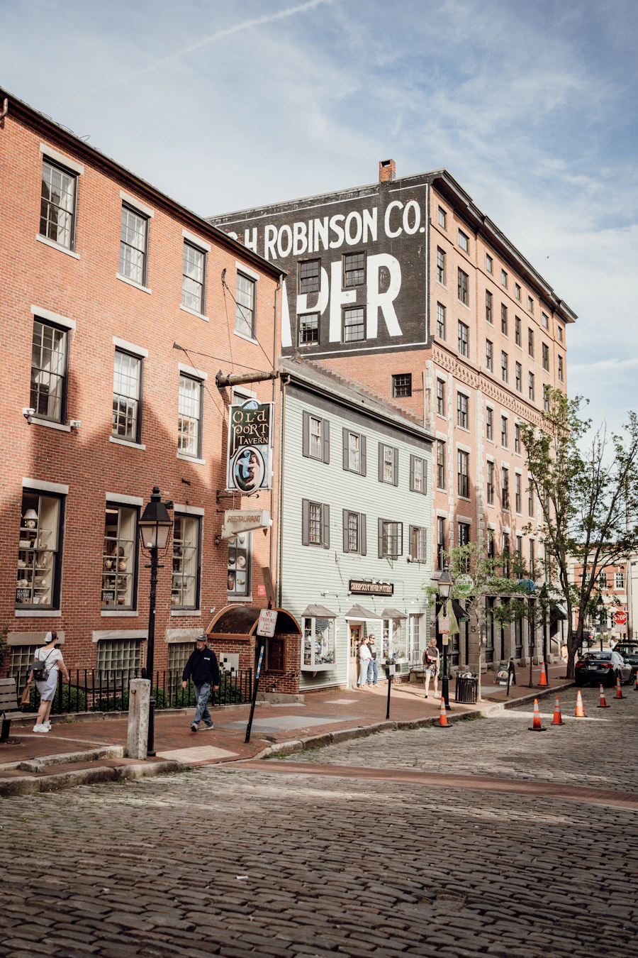 Brick warehouses on a cobbled Old Port street