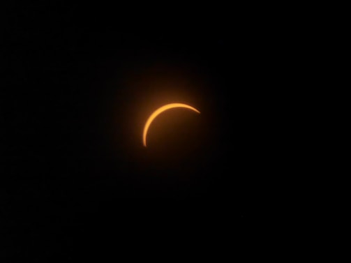 A solar eclipse seen through a telescope lens
