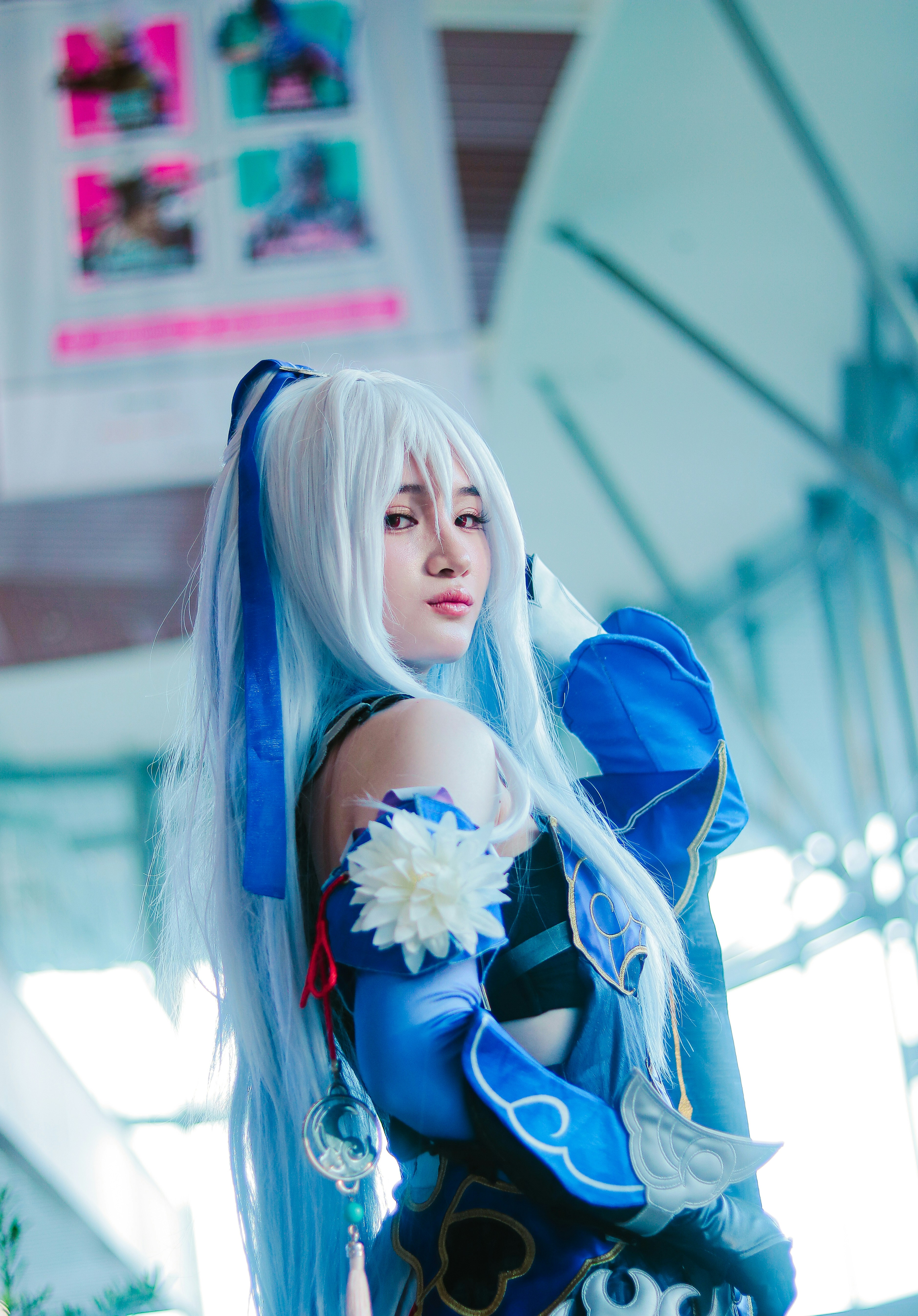 A woman dressed in a blue and white outfit