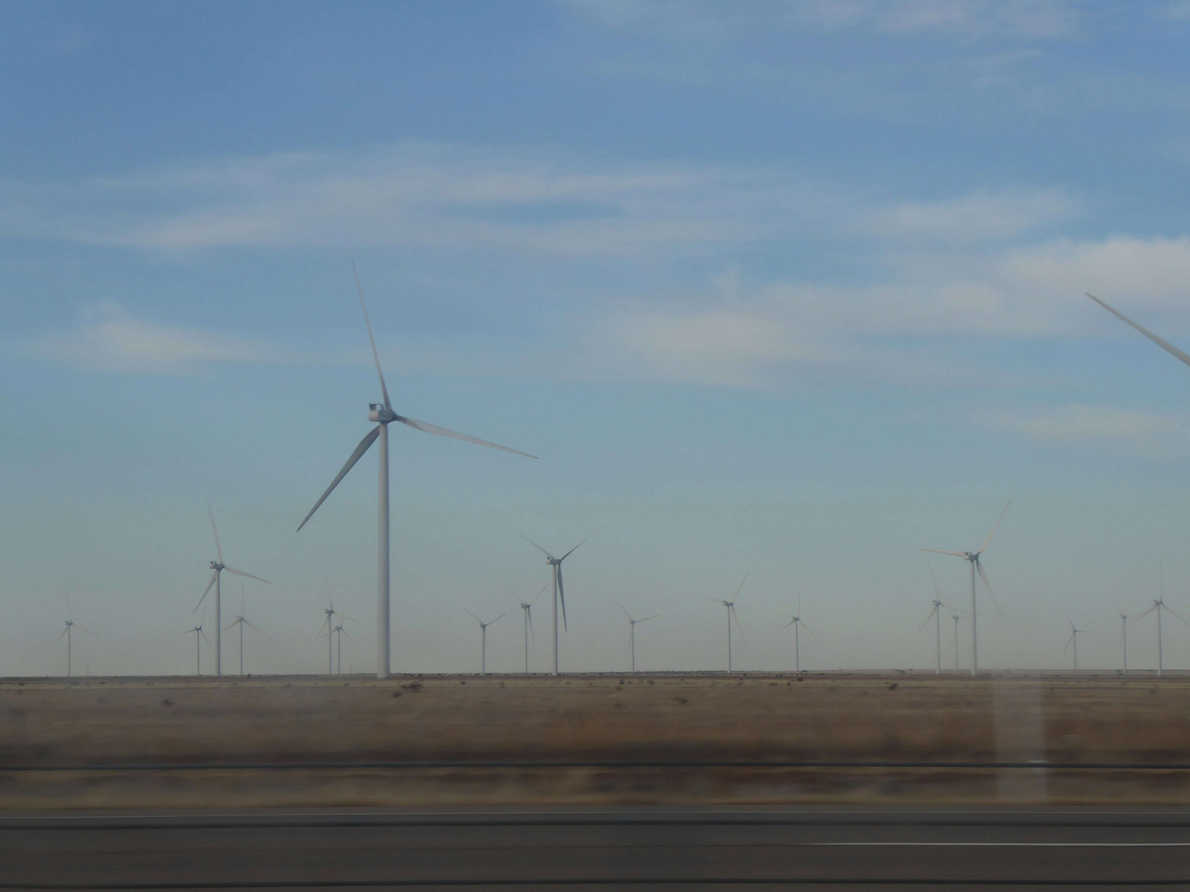 A bunch of windmills that are in the air