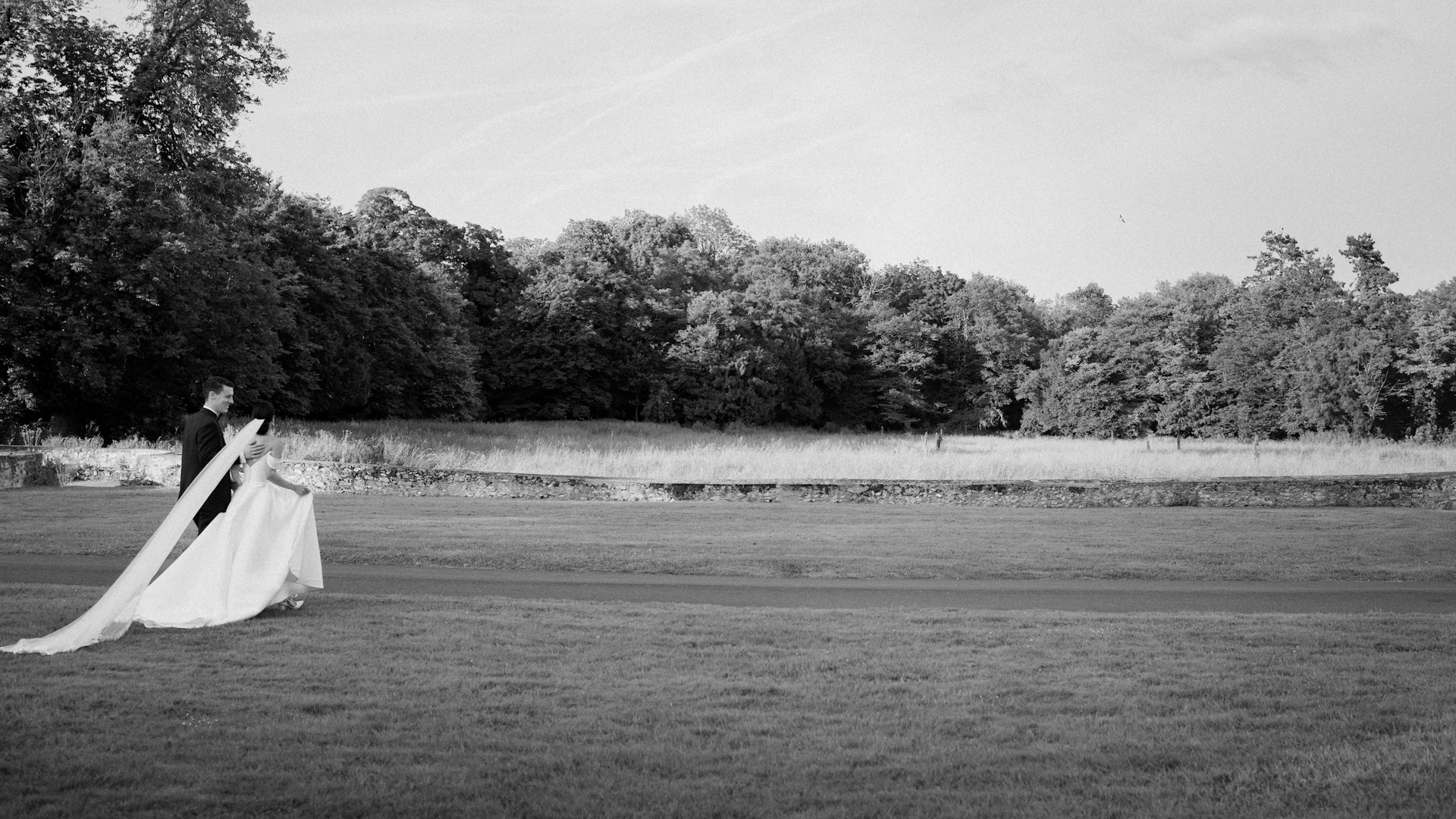 A black and white photo of a woman in a wedding dress