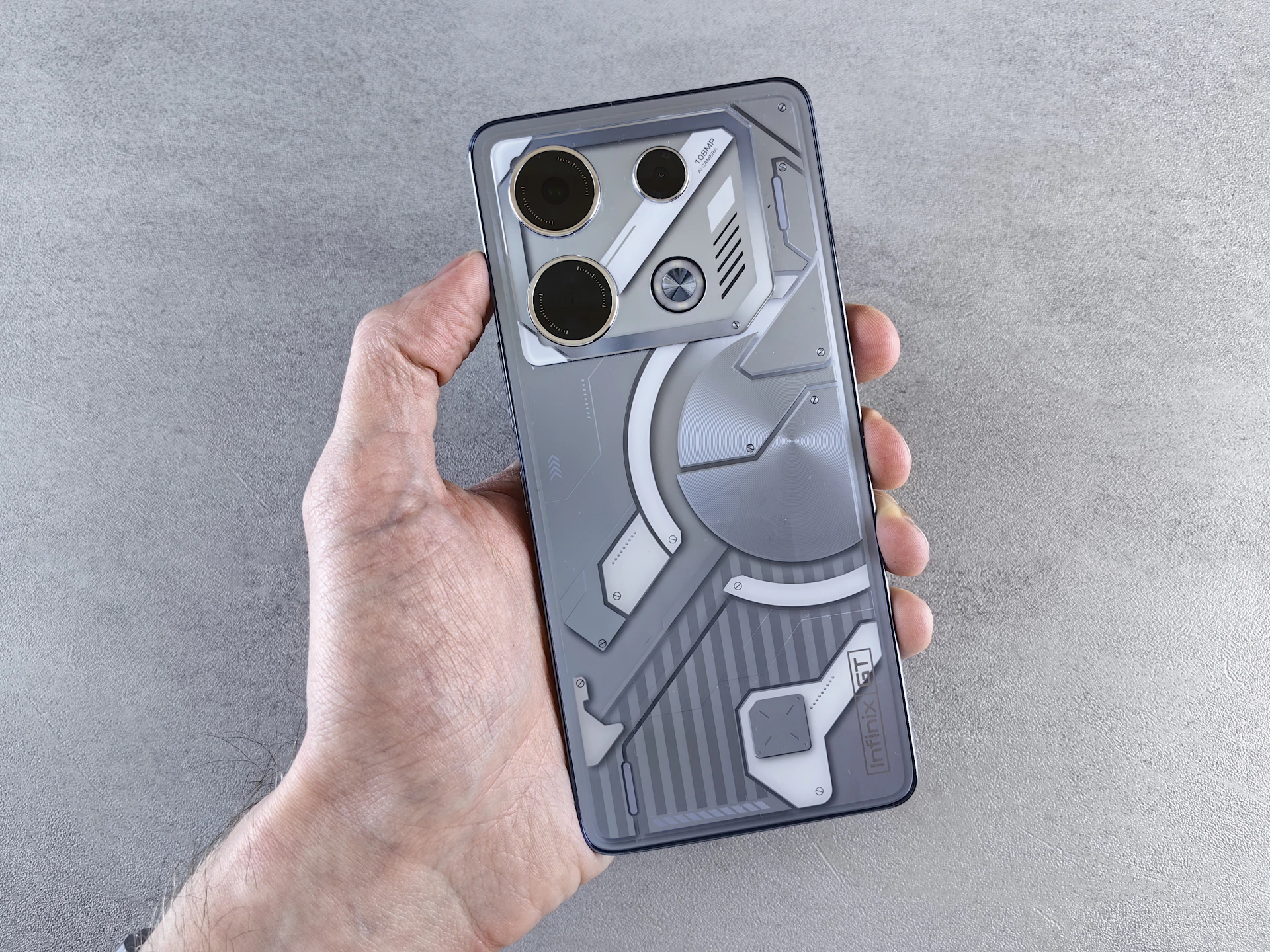 A person holding a cell phone in their hand