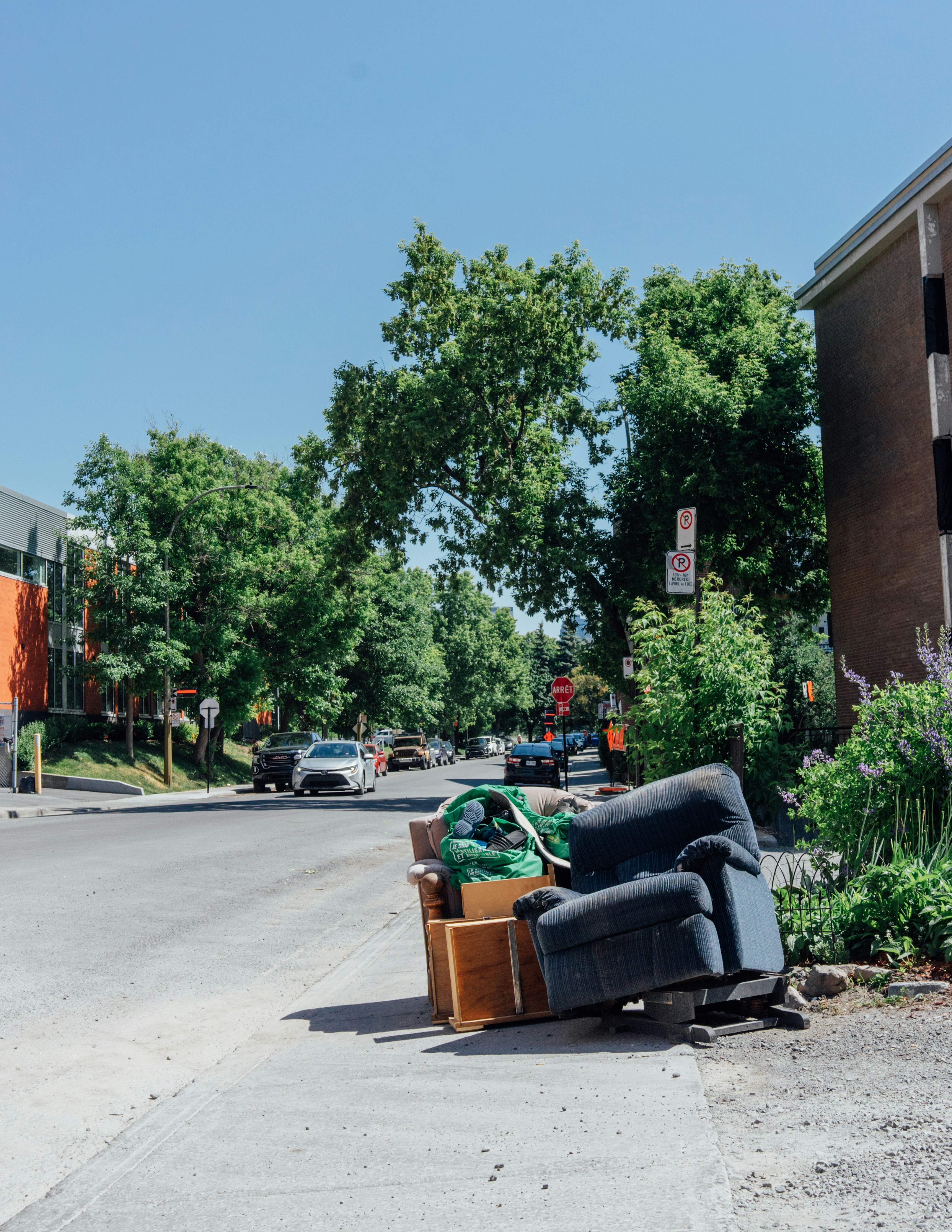 A pile of furniture sitting on the side of a road