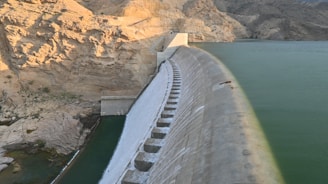 A large body of water next to a mountain