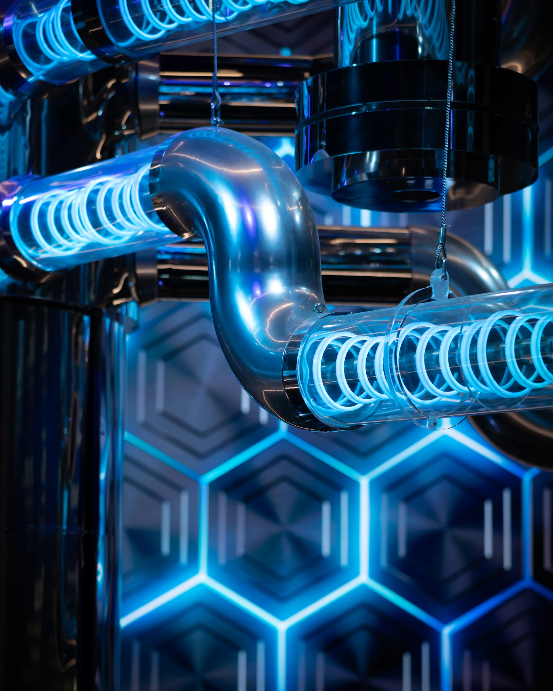 A close up of a metal structure with blue lights