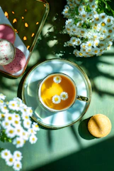 A cup of tea and some cookies on a table