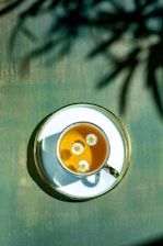 A cup of coffee with a smiley face on it