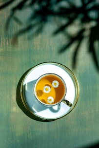 A cup of coffee with a smiley face on it