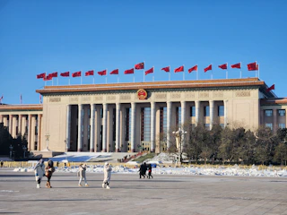 A group of people standing in front of a building