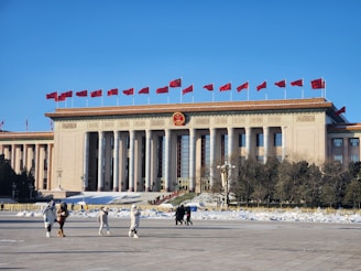 A group of people standing in front of a building