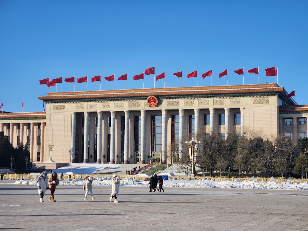 A group of people standing in front of a building,
