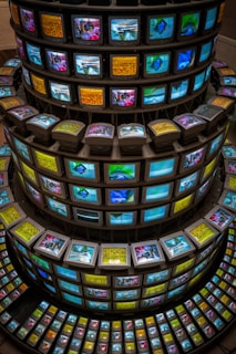 A large stack of televisions sitting on top of each other