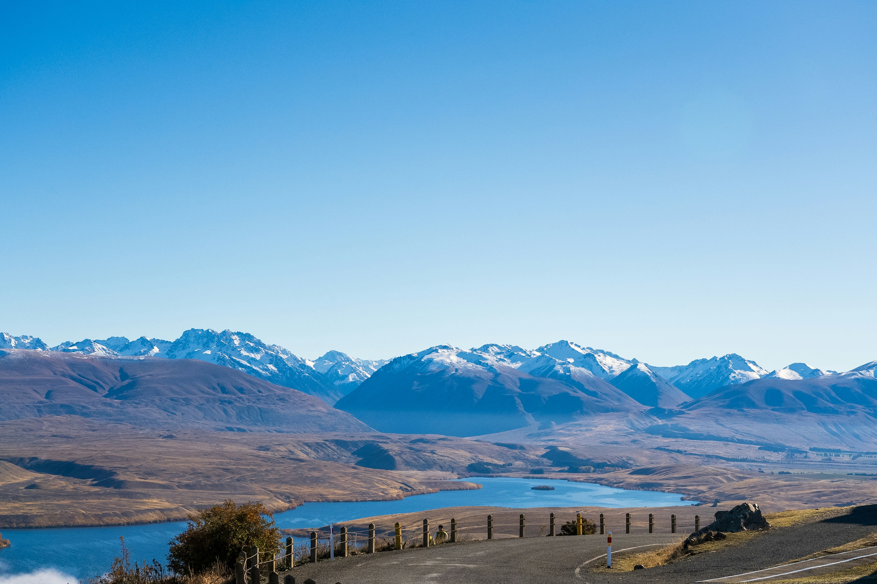 A view of a road with mountains in the background, 