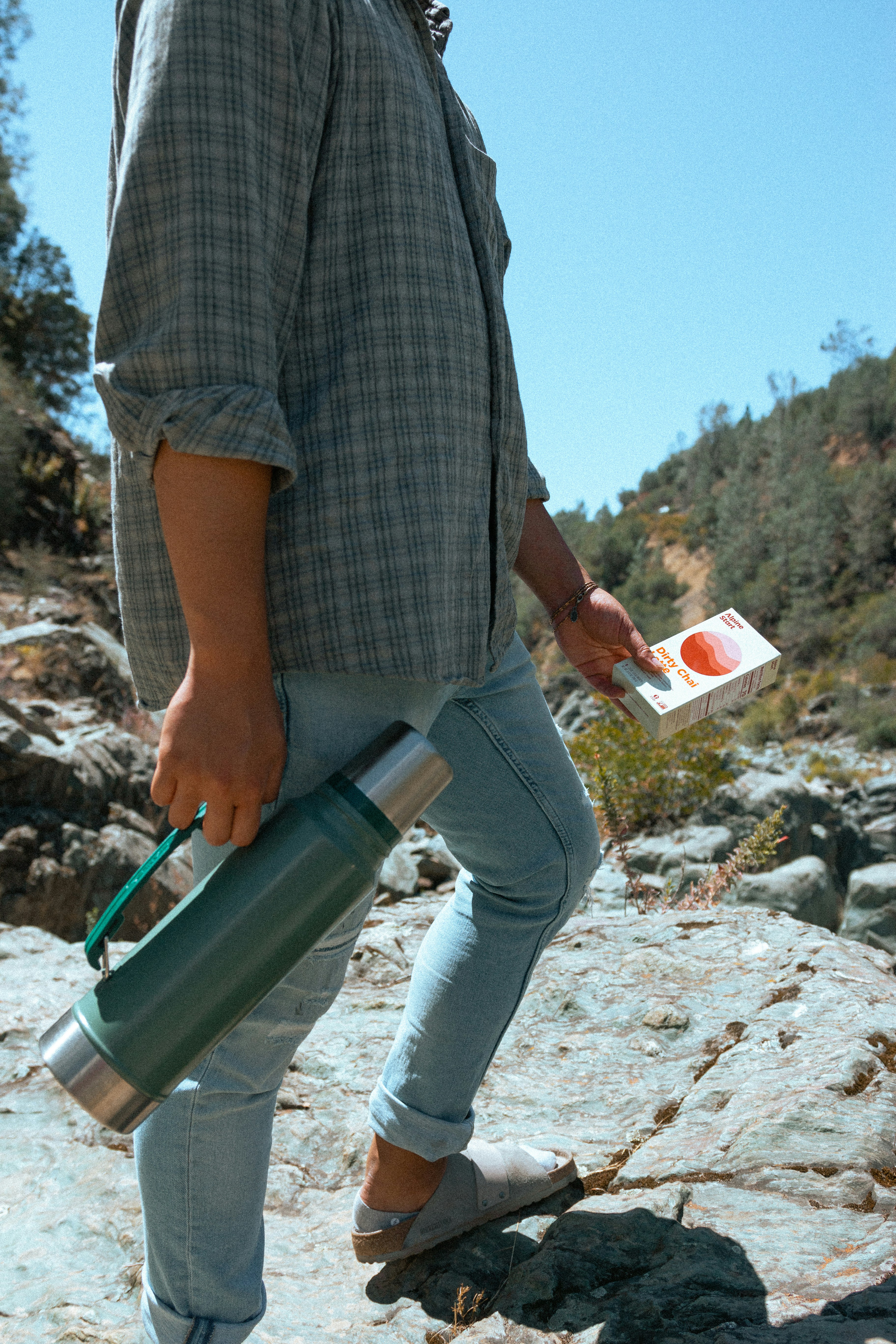 A man carrying a water bottle and a water bottle