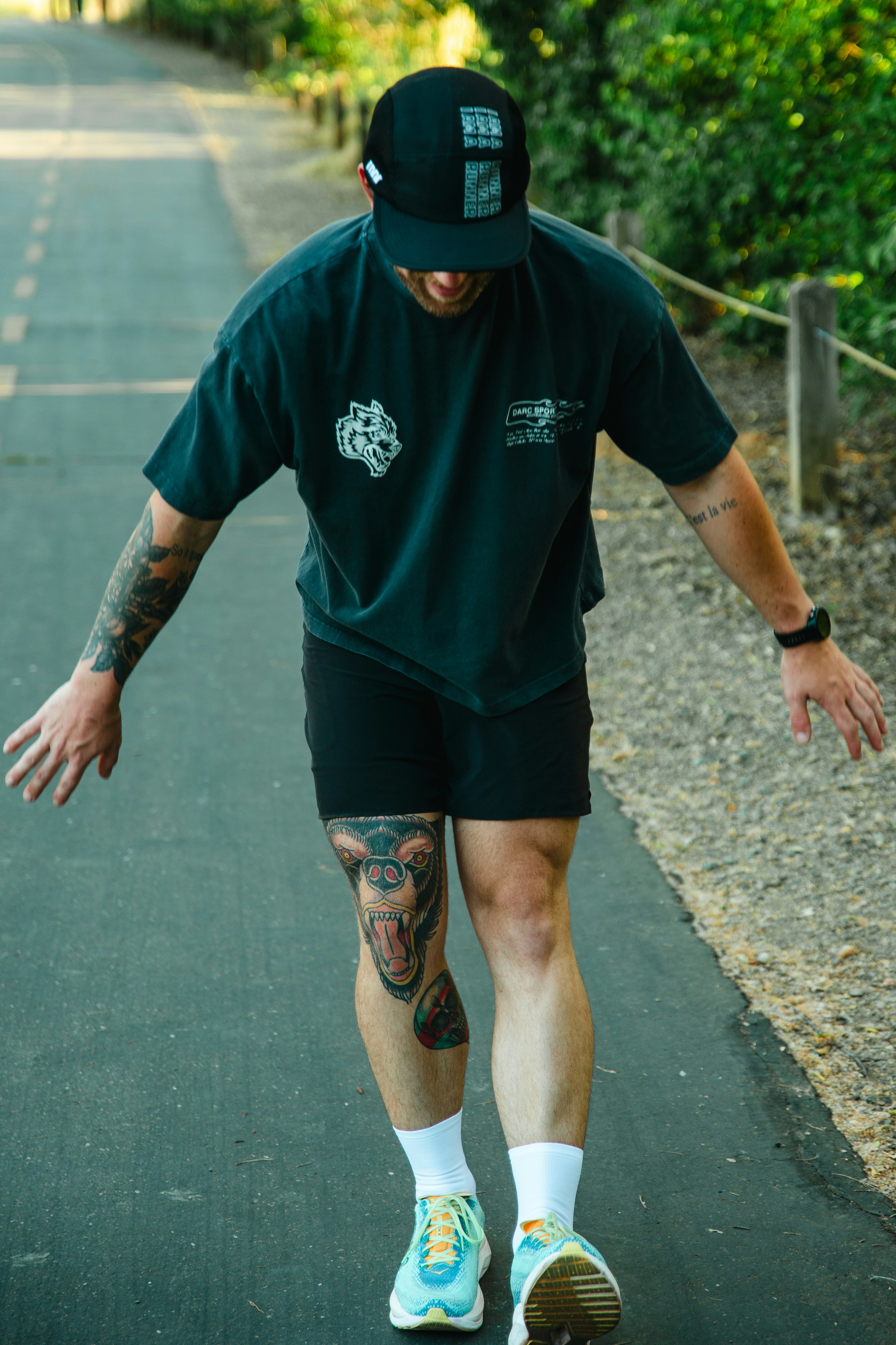 A man riding a skateboard down a street