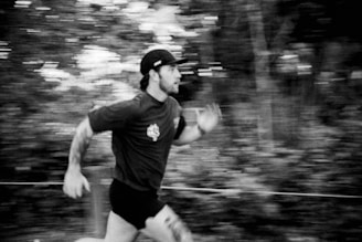 A black and white photo of a man running