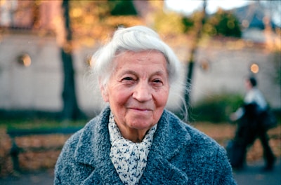 An old woman is walking down the street
