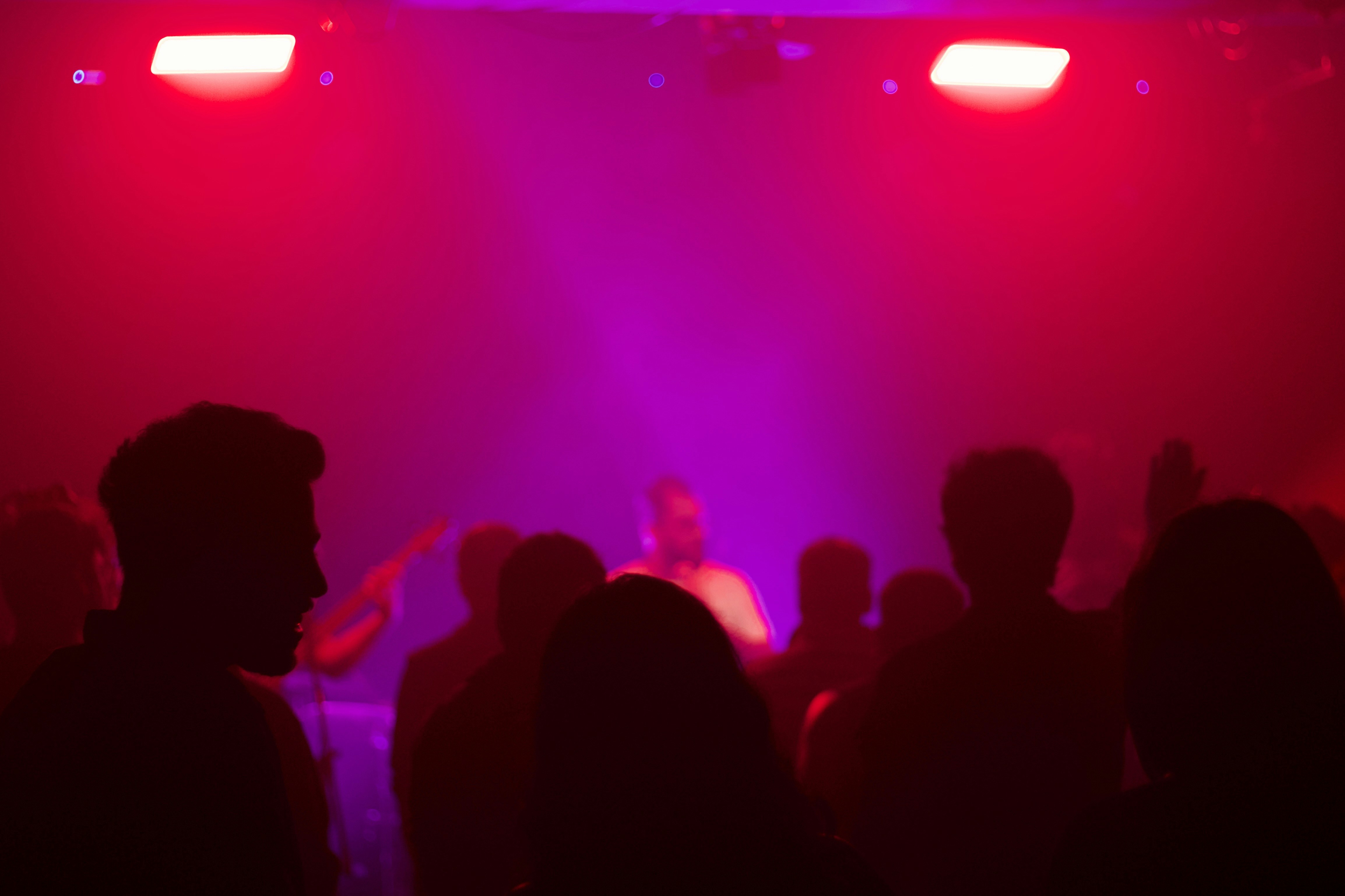 A group of people that are standing in front of a stage