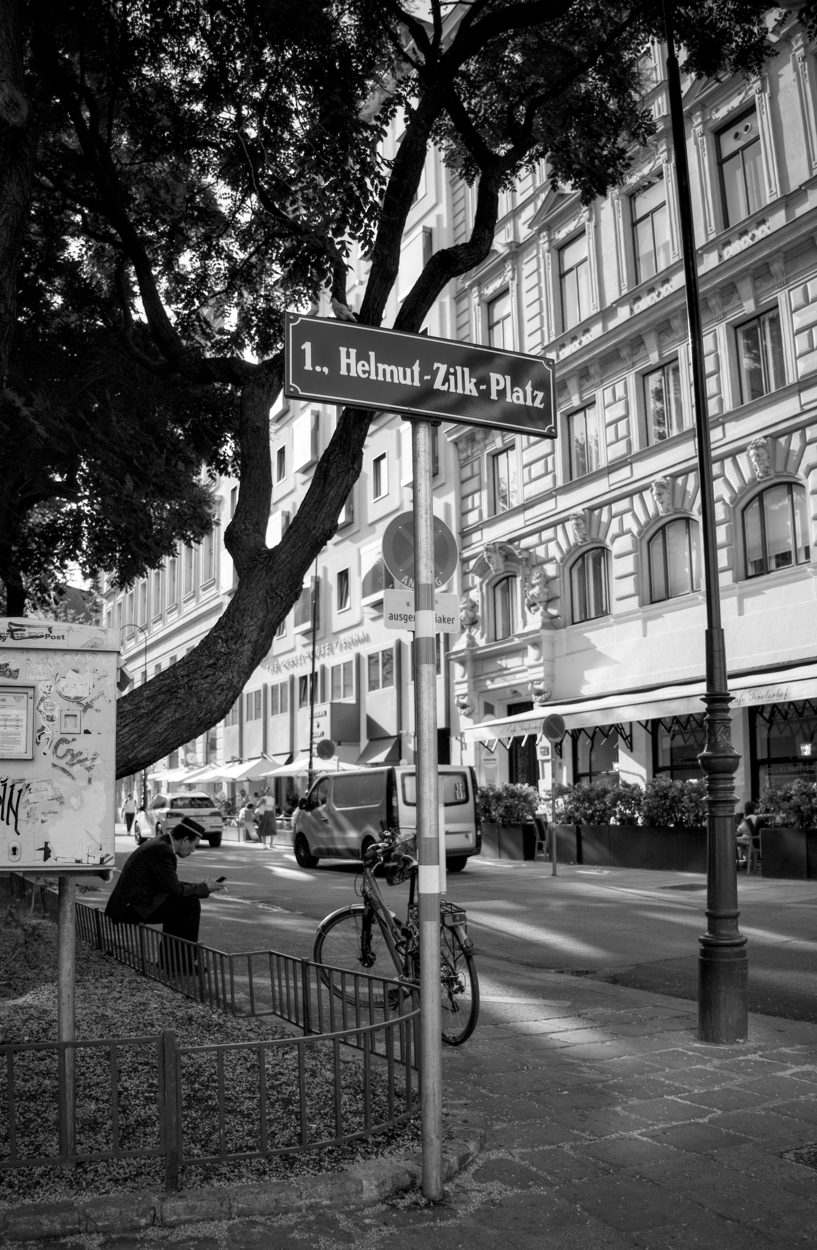 A black and white photo of a street sign