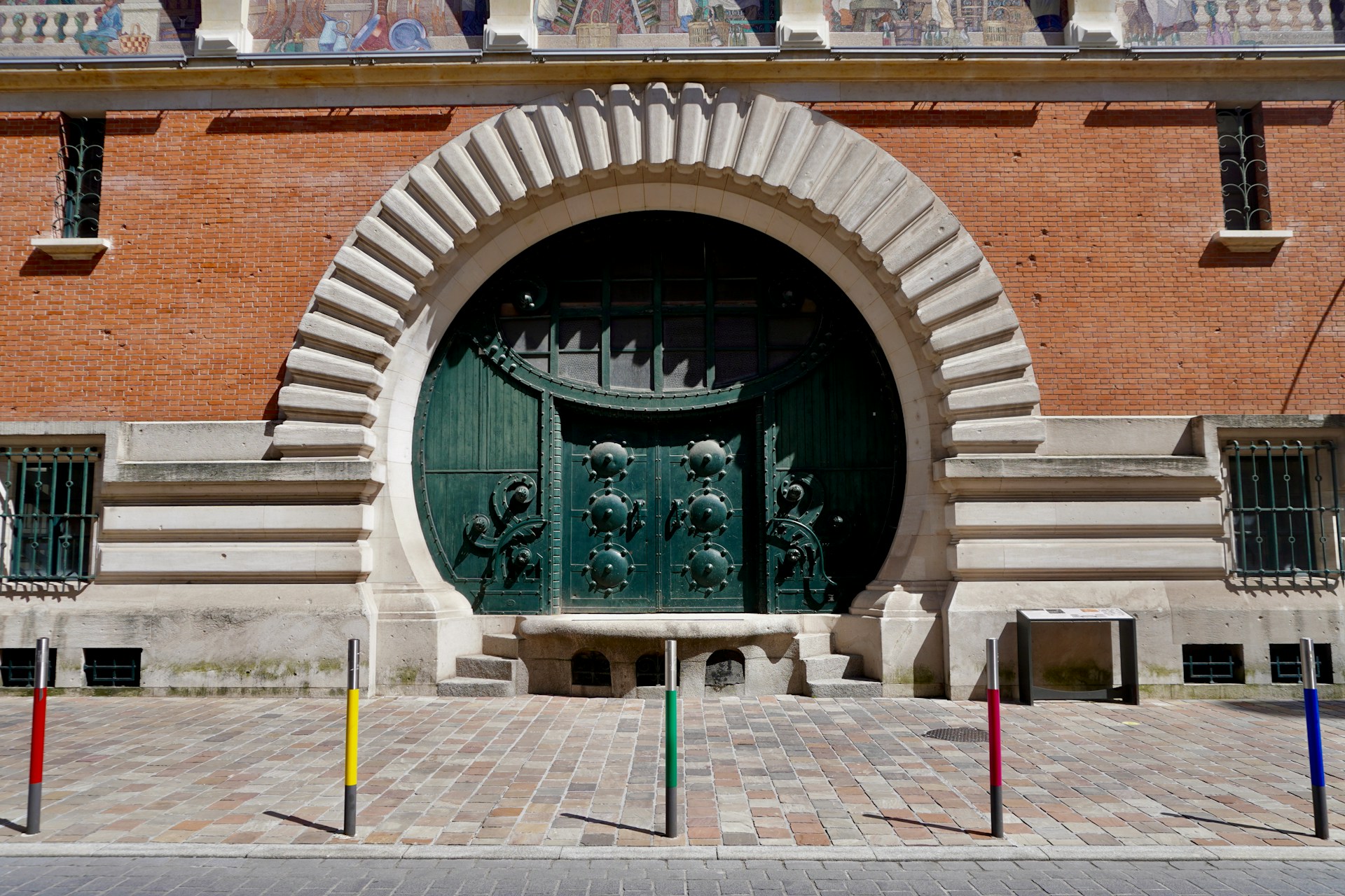 A large building with a large green door