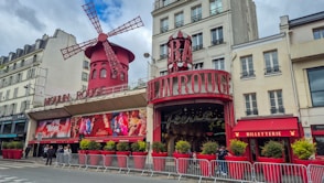 A red building with a windmill on top of it
