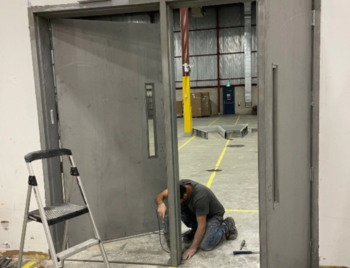 Vinko working on a sliding door repair