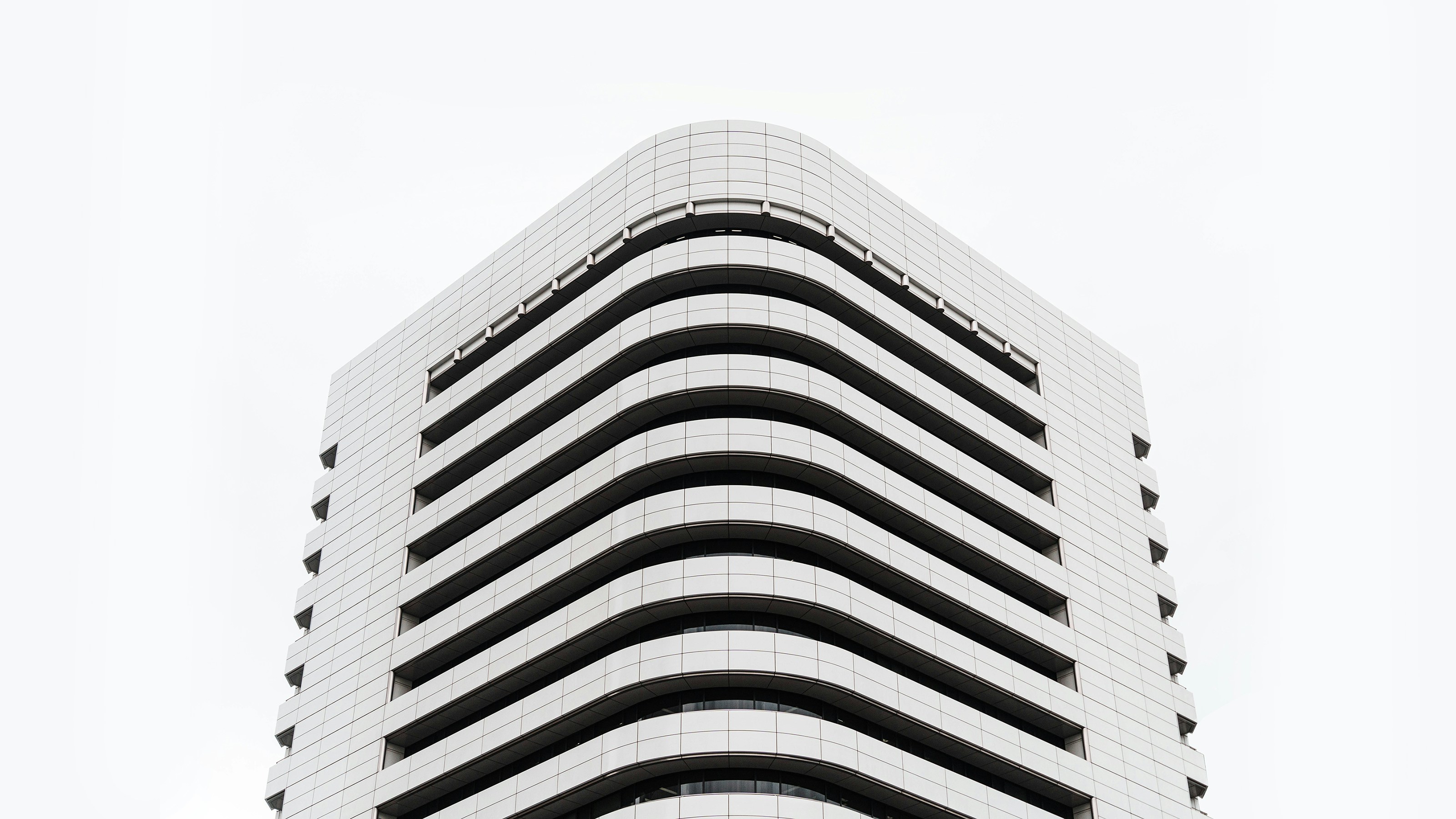 A very tall building with a clock on it's side