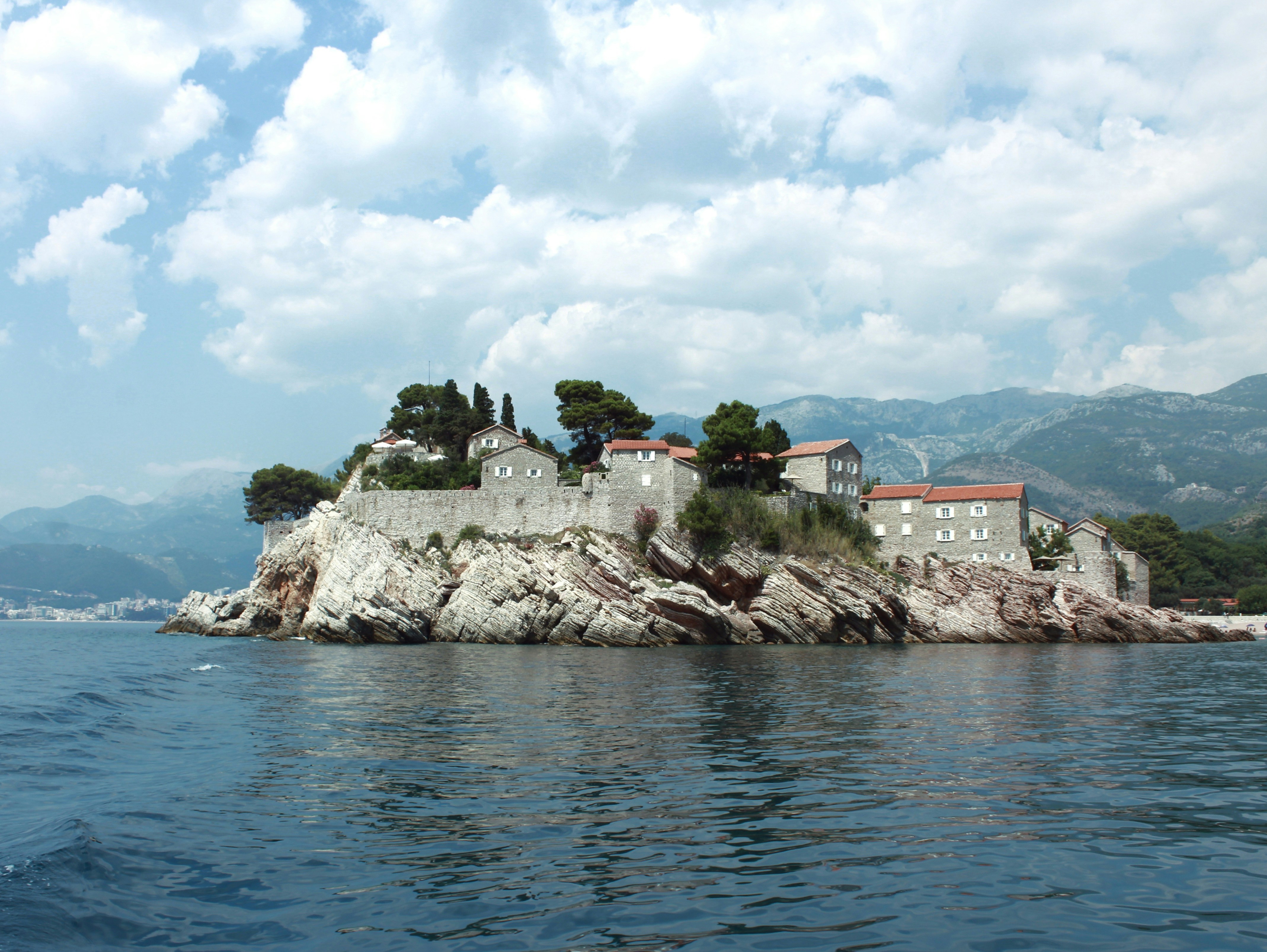 A small island in the middle of a body of water