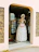 A woman in a dress made out of rolls of toilet paper