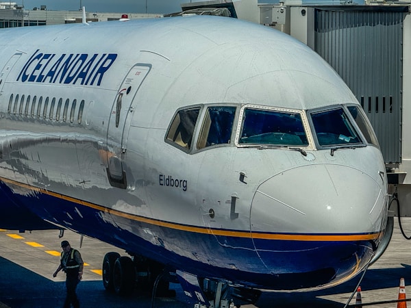 A large jetliner sitting on top of an airport tarmac