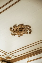 A room with a ceiling that has a fancy design on it